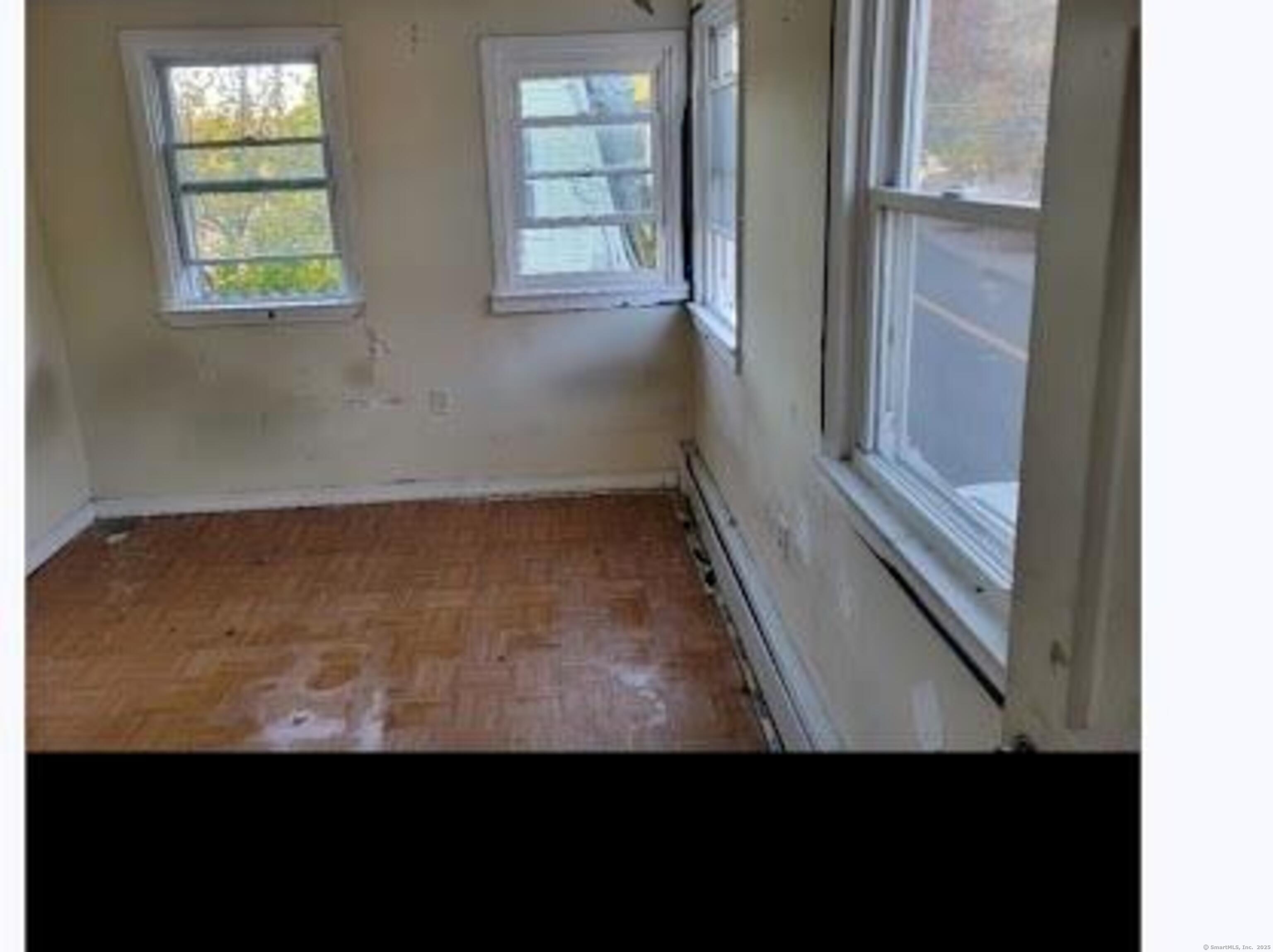 387 Colony Street Meriden, CT 06451 - Photo 8 of 8 a view of an empty room with a window