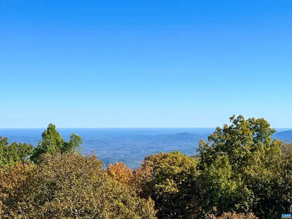 a view of a large body of water with a building in the background