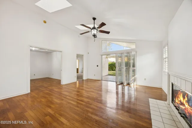a view of an empty room and fire place