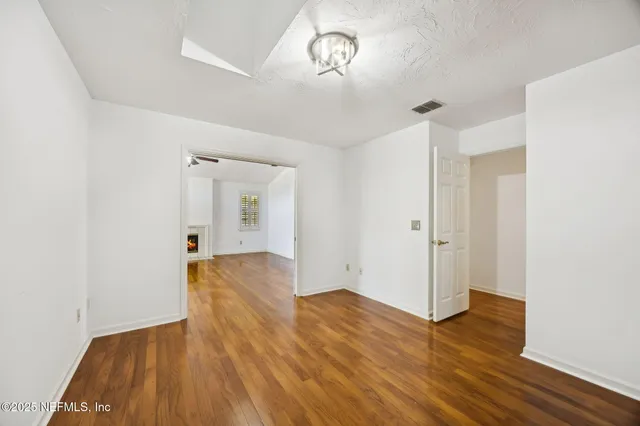 a view of kitchen with stainless steel appliances granite countertop refrigerator sink and stove