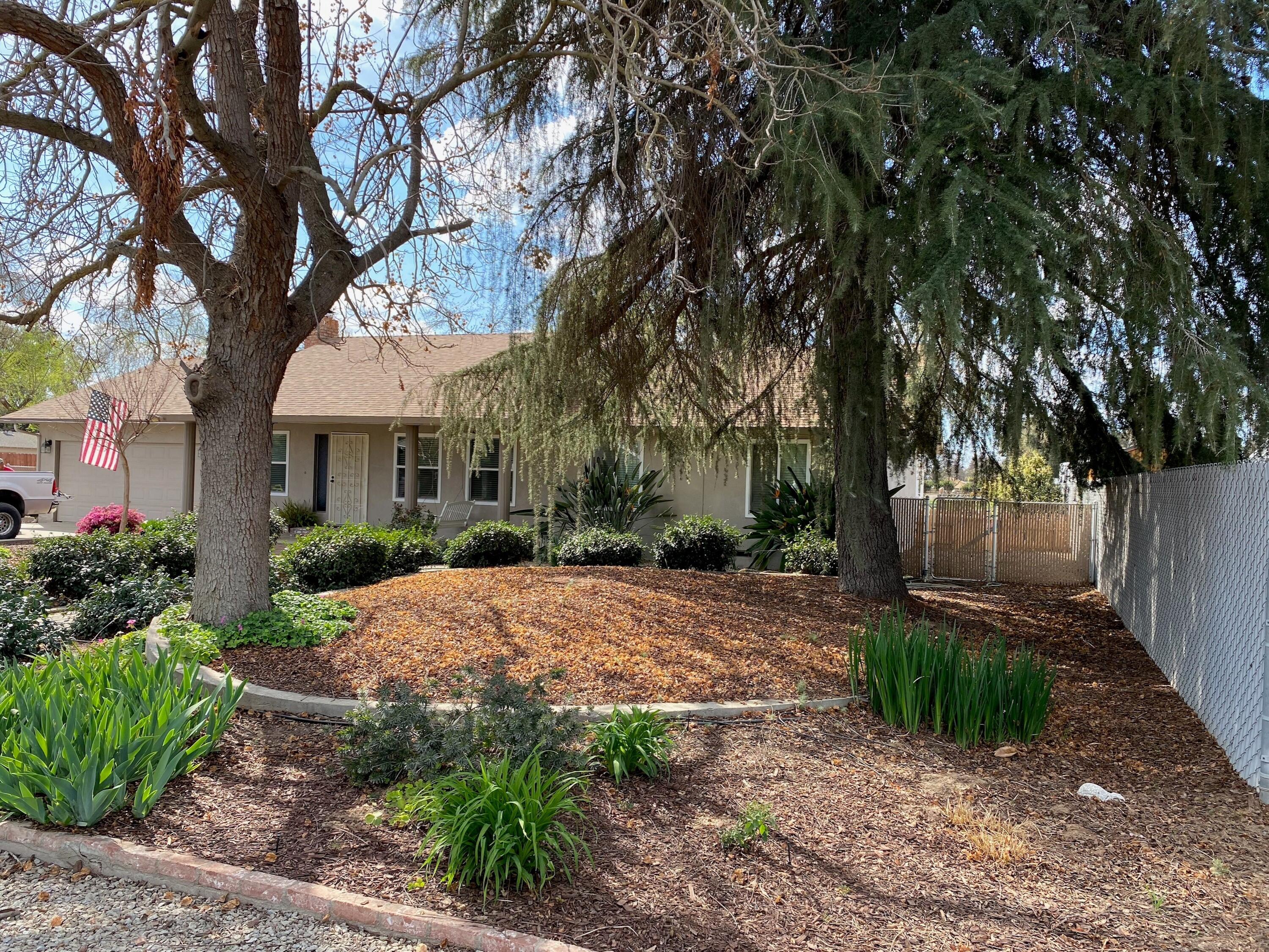 351 South Cornucopia Road Exeter, CA 93221 - Photo 3 of 22 a view of a house with a tree in the yard