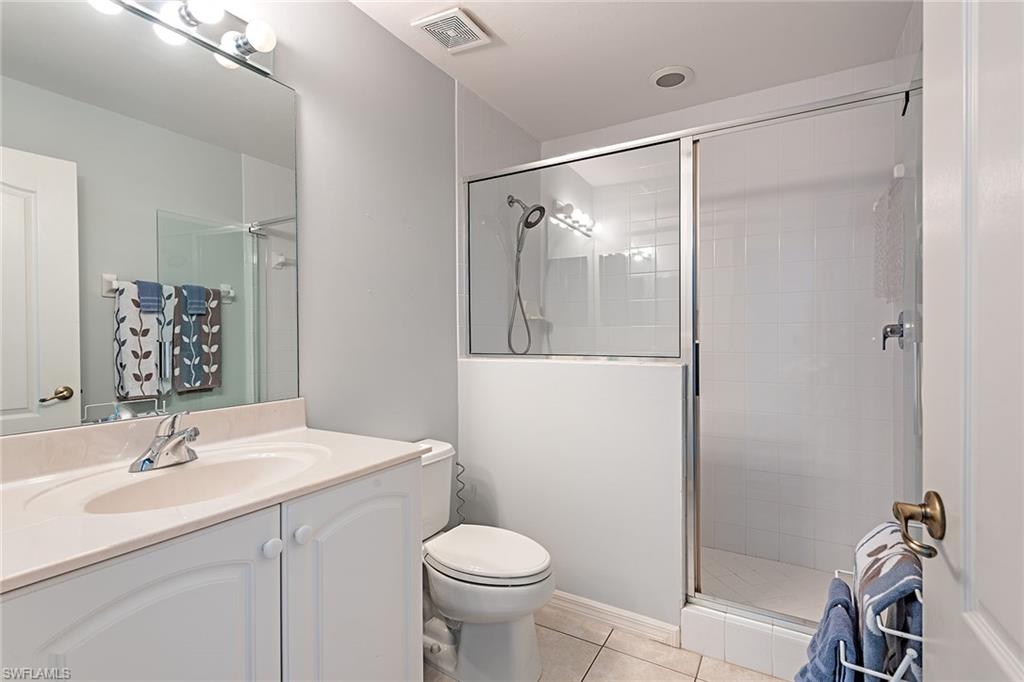 2540 Talon Court, Unit 503 Naples, FL 34105 - Photo 11 of 14 a bathroom with a sink toilet and shower