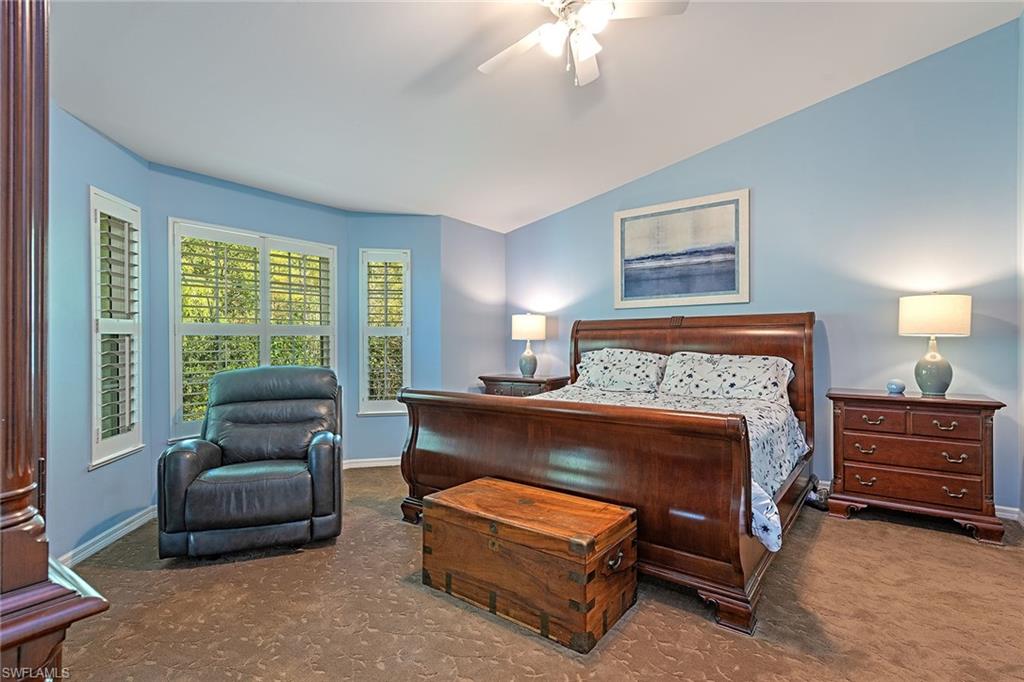 2540 Talon Court, Unit 503 Naples, FL 34105 - Photo 6 of 14 a bedroom with furniture and a large window