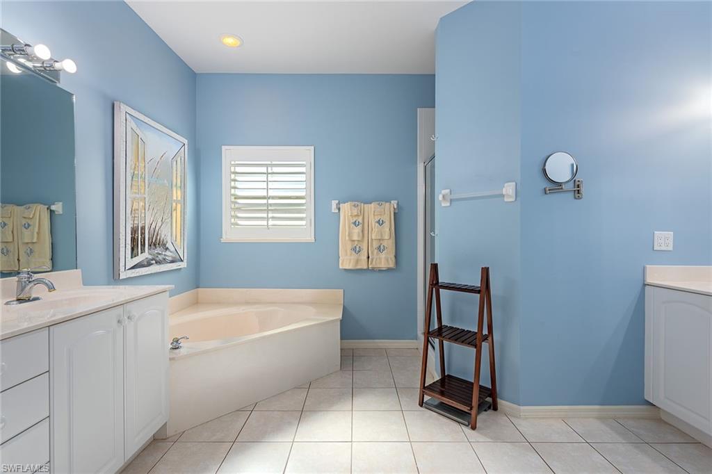 2540 Talon Court, Unit 503 Naples, FL 34105 - Photo 7 of 14 a spacious bathroom with a bathtub sink and toilet
