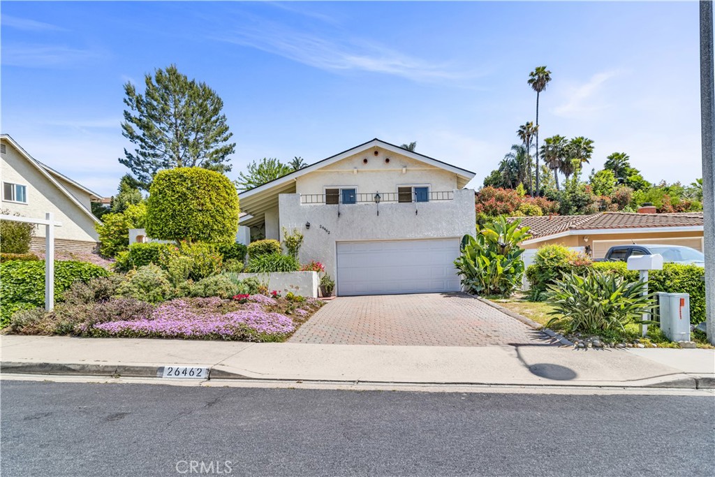 26462 Naccome Drive Mission Viejo, CA 92691 - Photo 1 of 52 a front view of a house with a yard and potted plants