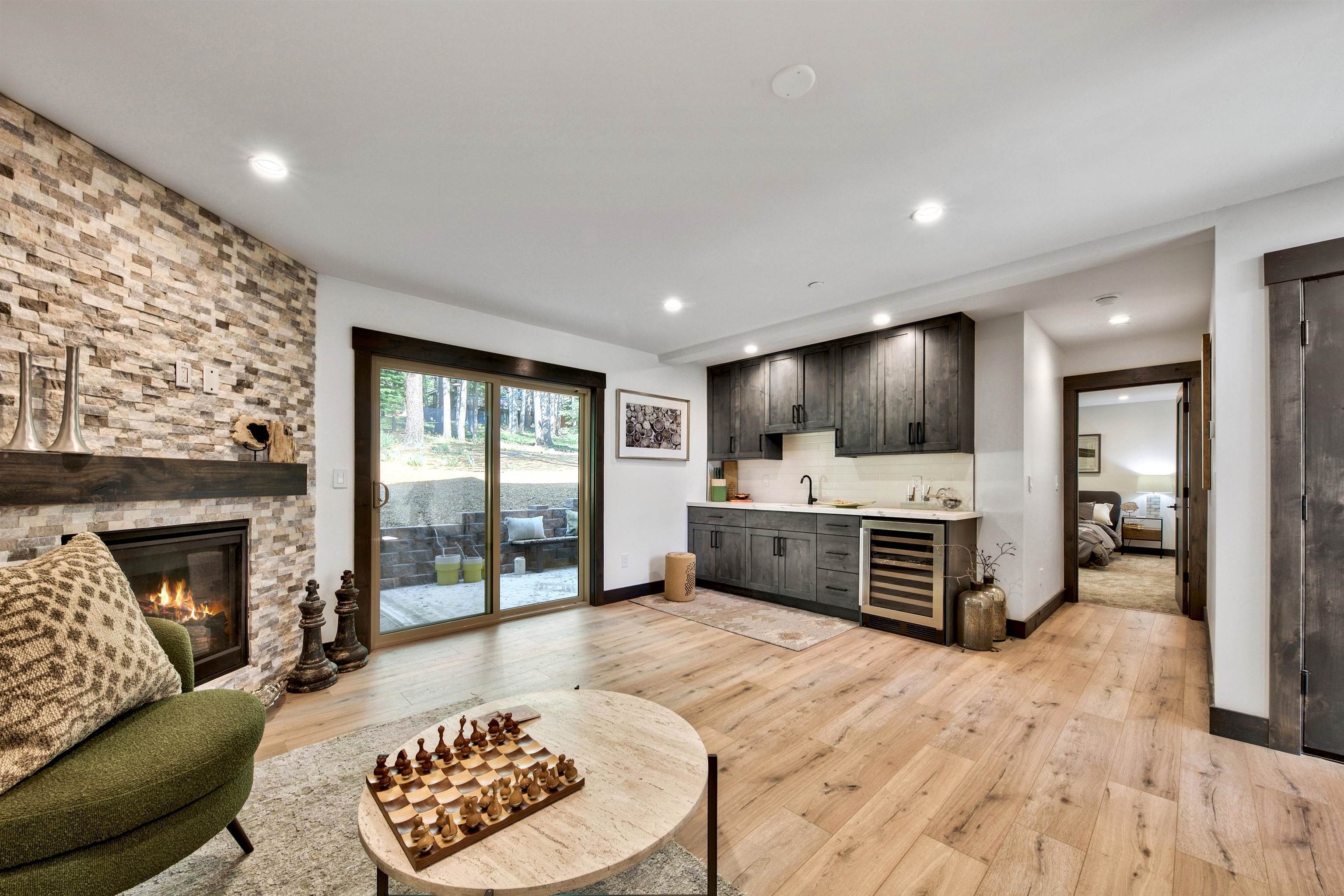 11545 Bennett Flat Road Truckee, CA 96161 - Photo 17 of 21 a living room with furniture flat screen tv and a fireplace