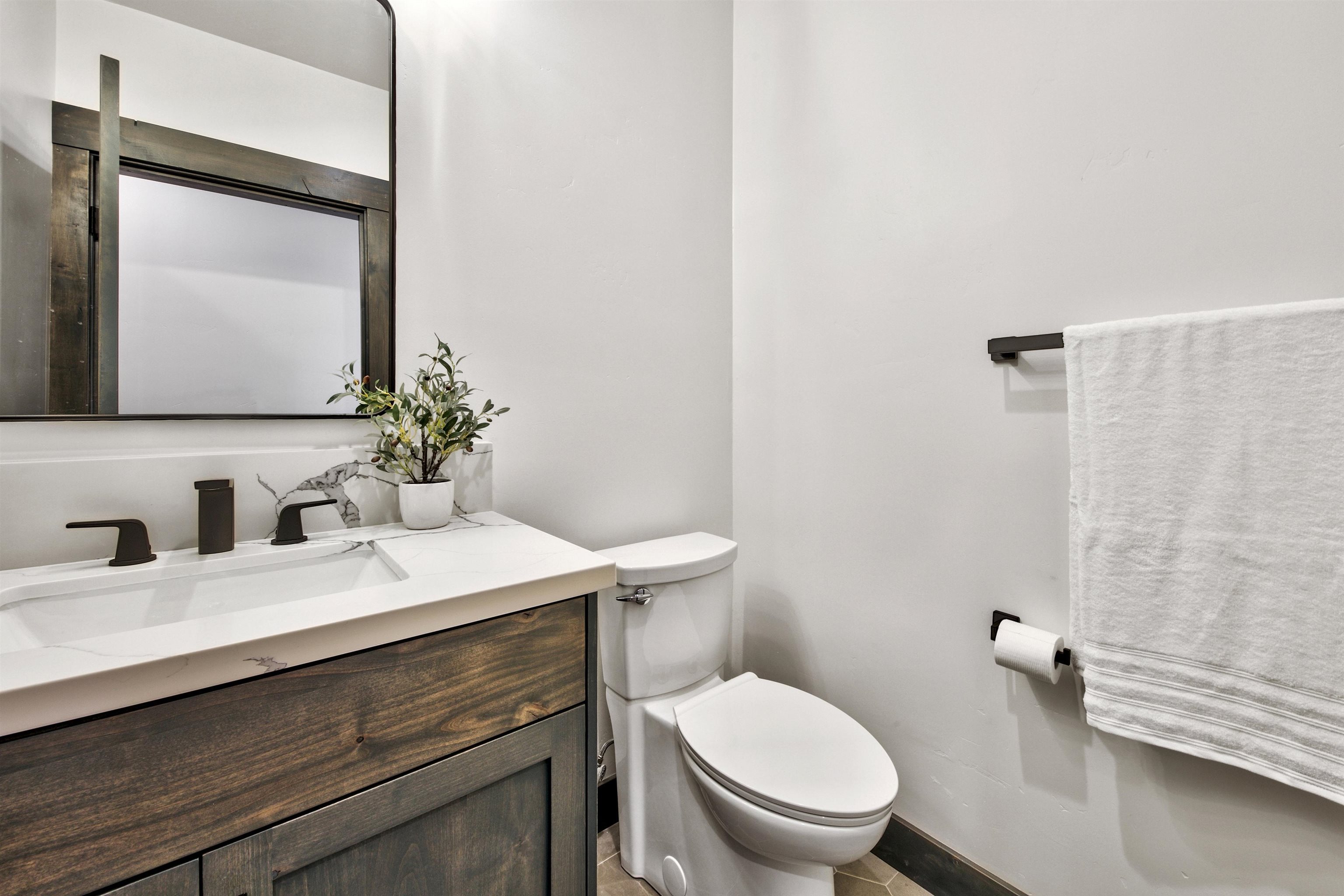 11545 Bennett Flat Road Truckee, CA 96161 - Photo 21 of 21 a bathroom with a sink vanity mirror and toilet