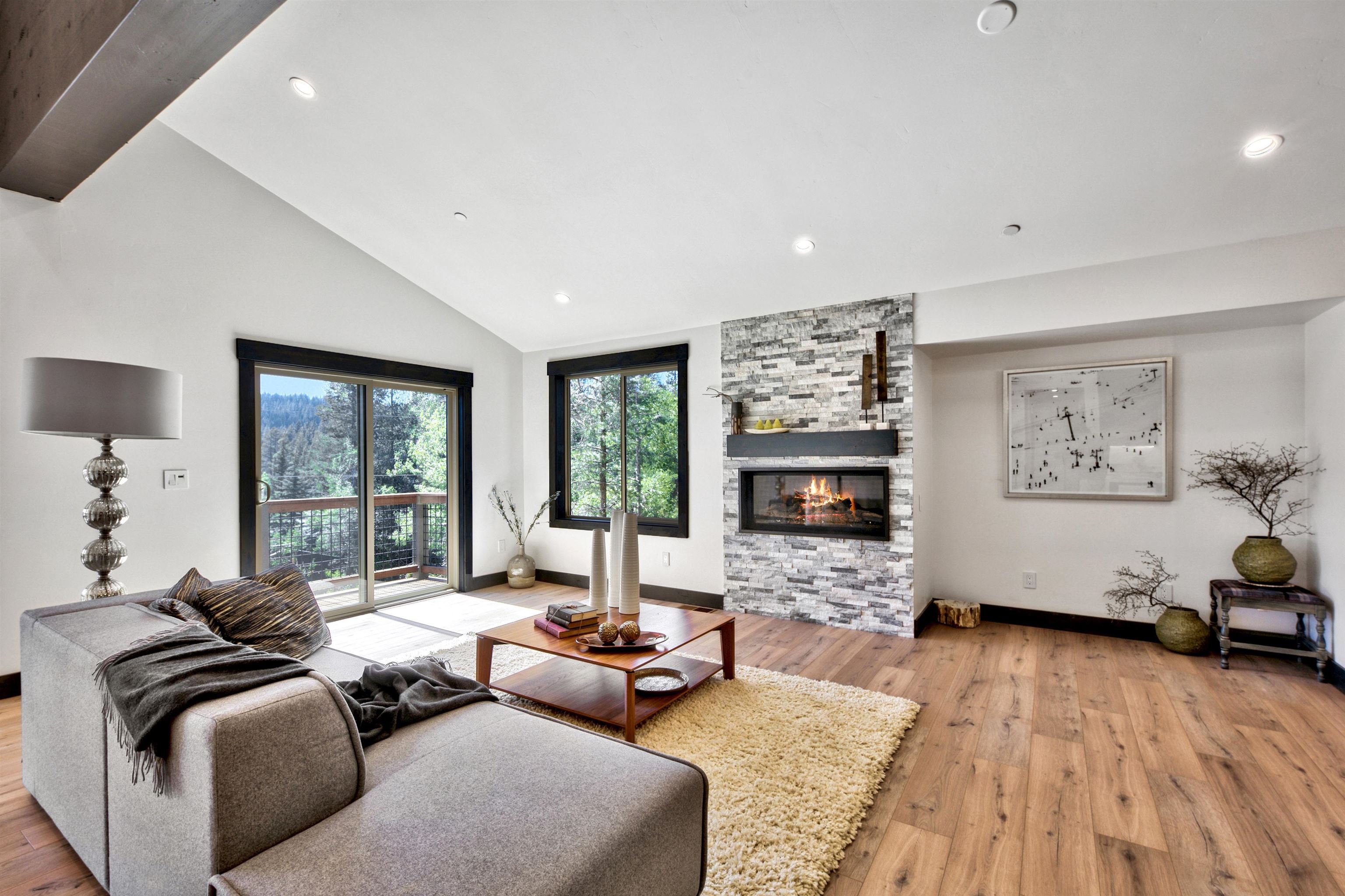 11545 Bennett Flat Road Truckee, CA 96161 - Photo 4 of 21 a living room with furniture window and a fireplace