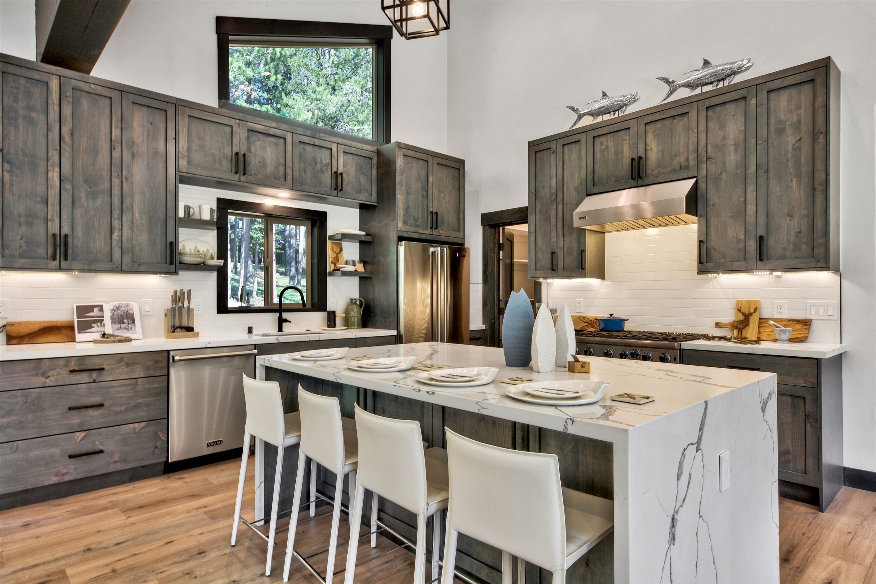 11545 Bennett Flat Road Truckee, CA 96161 - Photo 6 of 21 a kitchen with stainless steel appliances granite countertop a table chairs and white cabinets