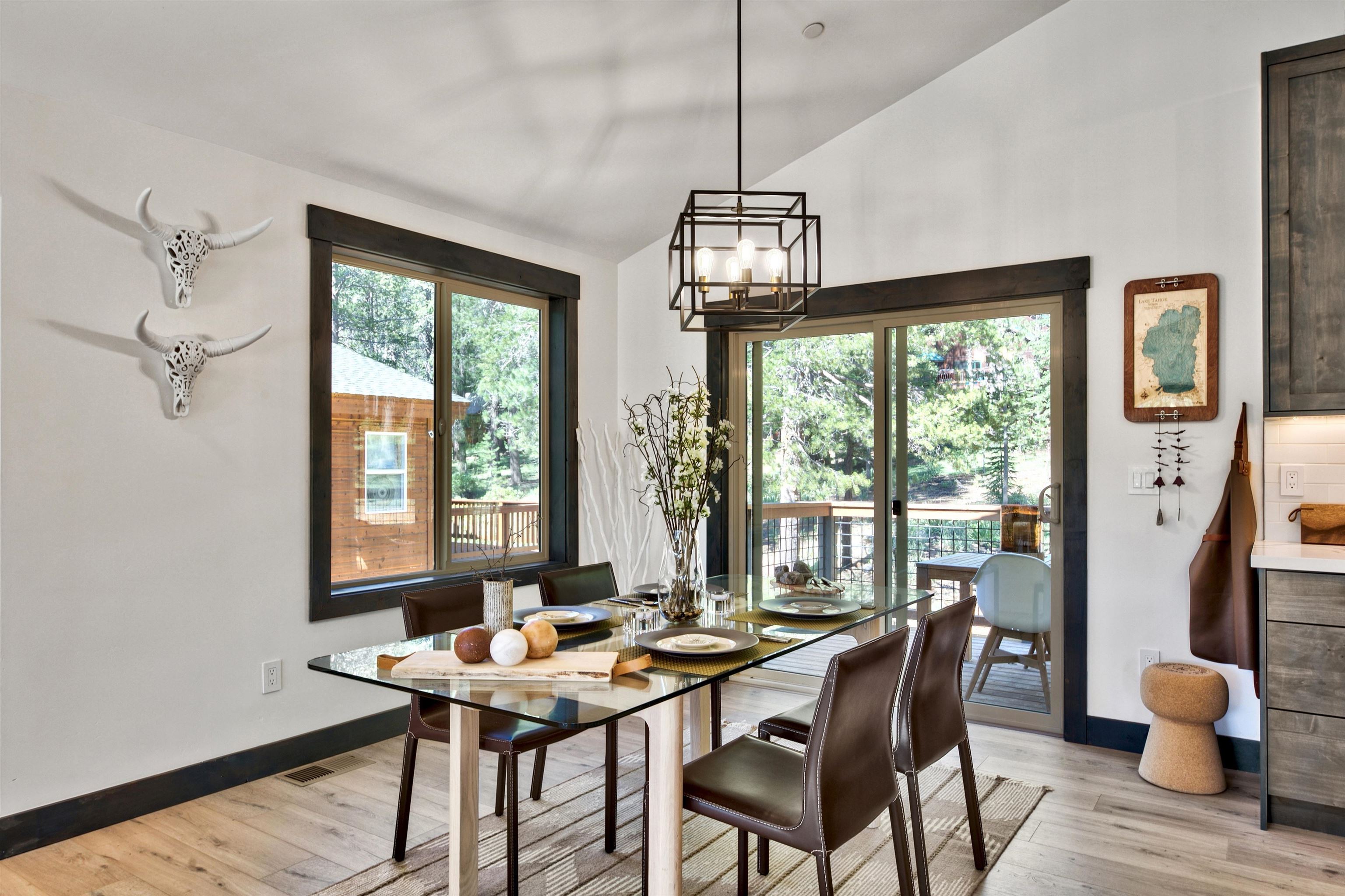 11545 Bennett Flat Road Truckee, CA 96161 - Photo 9 of 21 a view of a dining room with furniture wooden floor and chandelier