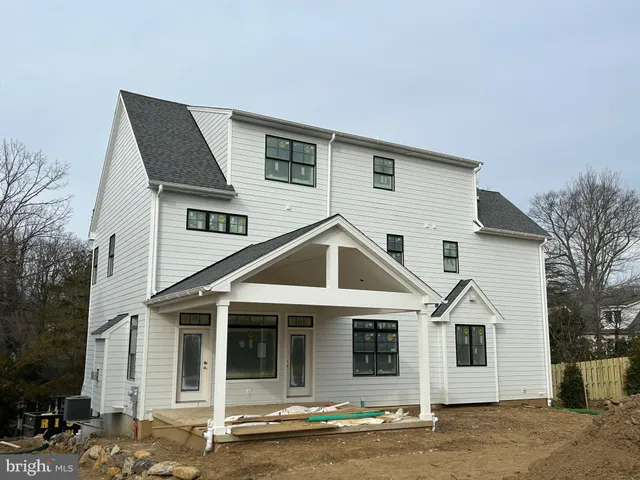a front view of a house with yard and garage
