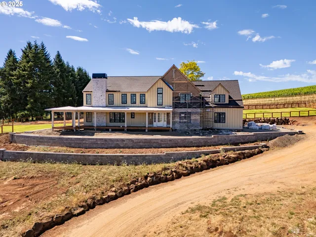 a front view of a house with a big yard
