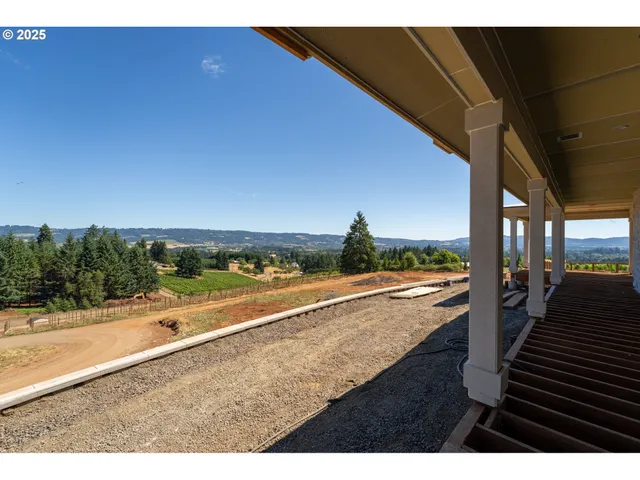 a view of an ocean and city from a balcony