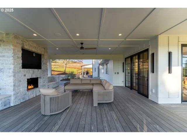 a living room with fireplace furniture and a flat screen tv