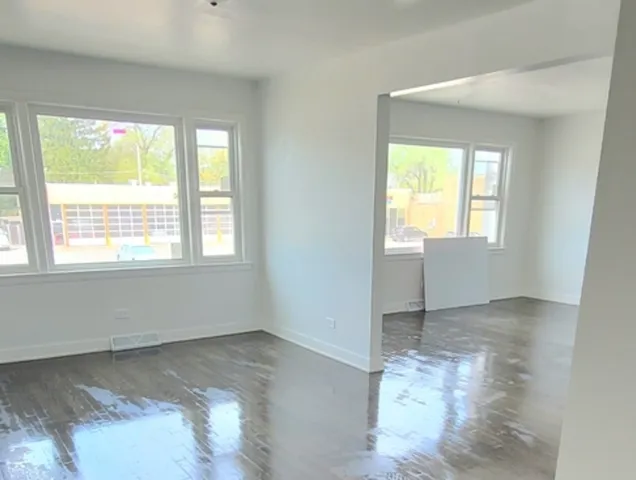 a view of an empty room and window