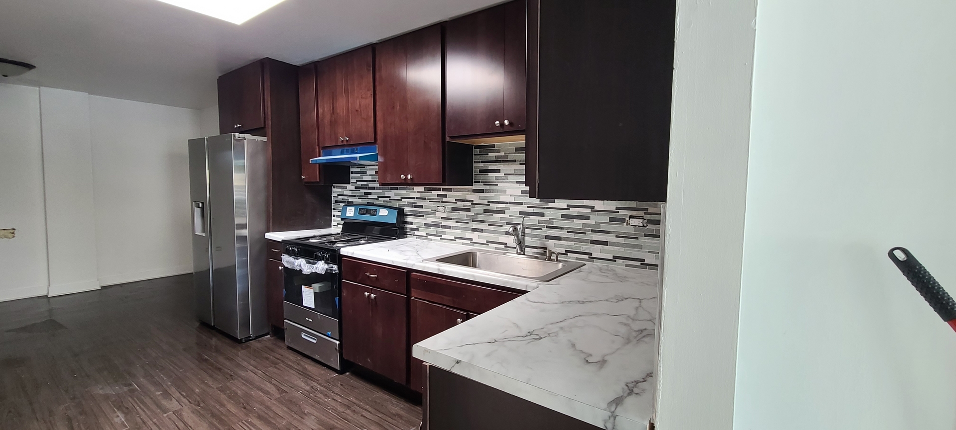 14751 Pulaski Road Midlothian, IL 60445 - Photo 9 of 18 a kitchen with stainless steel appliances granite countertop a sink stove and refrigerator