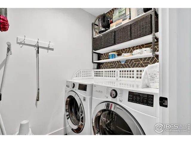 a bedroom with a large bed and a large window