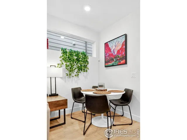 a kitchen with stainless steel appliances a sink a stove a refrigerator a center island and cabinets