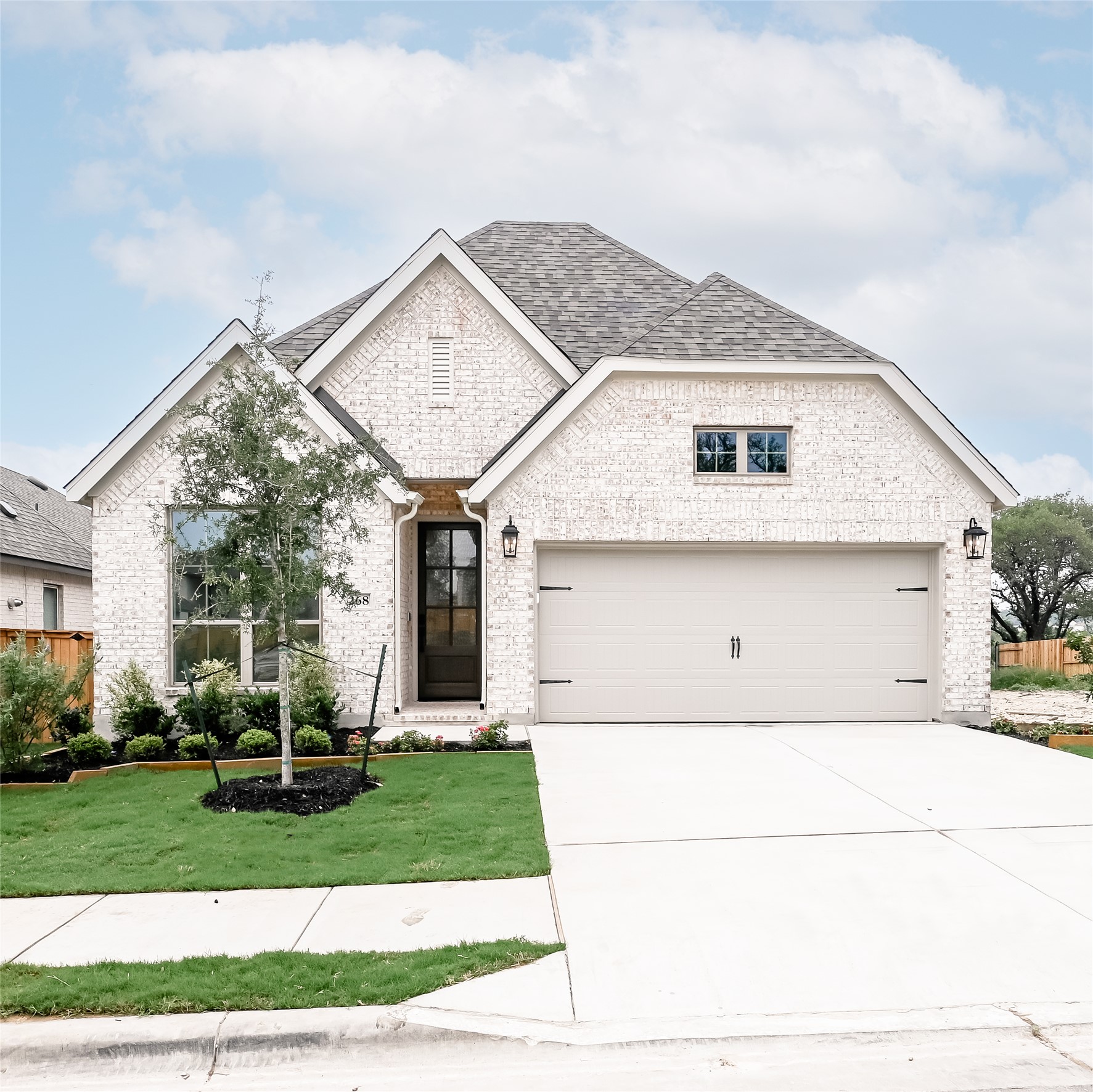 268 Basket Flower Loop Kyle, TX 78640 - Photo 24 of 27 a front view of a house with a yard