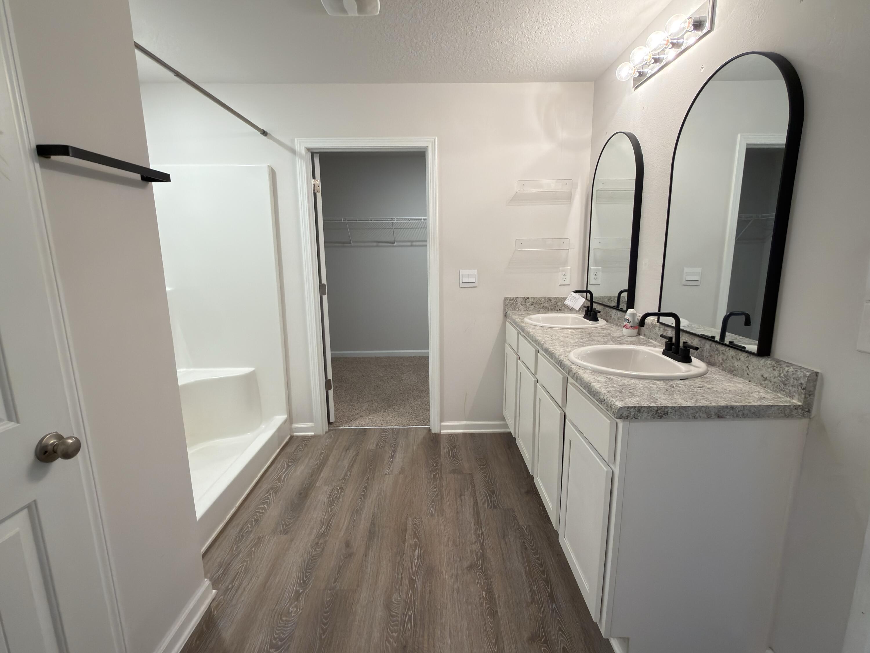 3545 Sugar Maple Lane Crestview, FL 32539 - Photo 13 of 27 a bathroom with a double vanity sink and mirror