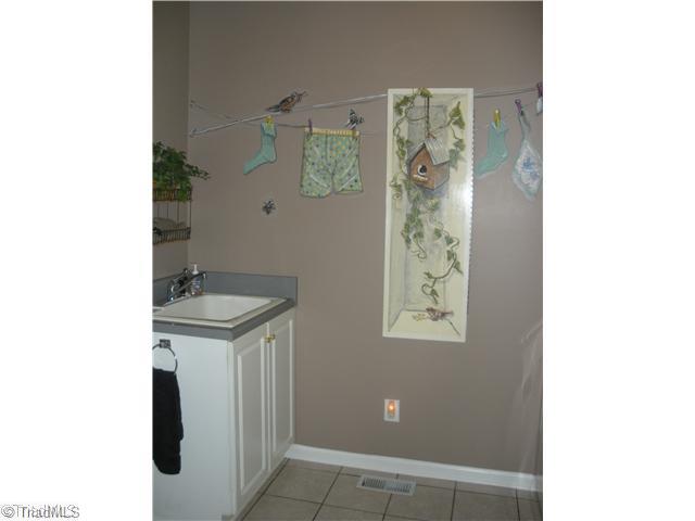 801 Shamrock Road High Point, NC 27265 - Photo 12 of 12 Laundry Room. Laundry room with ultility sink & built-in ironing board