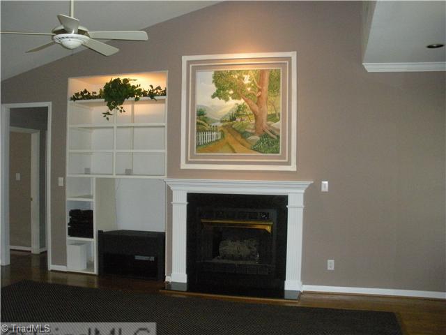 801 Shamrock Road High Point, NC 27265 - Photo 7 of 12 Den/Family/Great Room. Great room-vaulted ceiling with built-in entertainment center, hardwoods w/ recess carpet, lights & fireplace with gas logs.