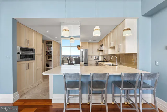 a large kitchen with a table and chairs