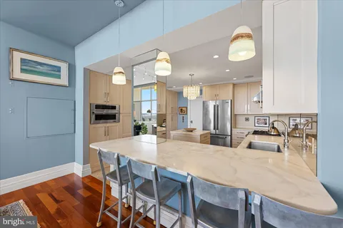 a living room with furniture a rug and a large window