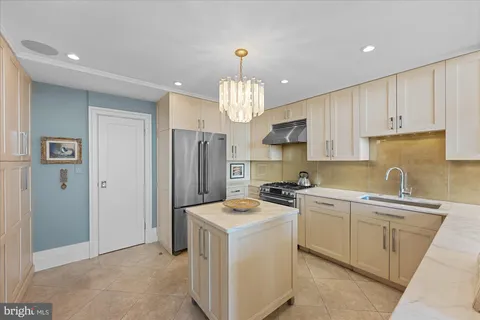 a bathroom with a toilet sink vanity and mirror