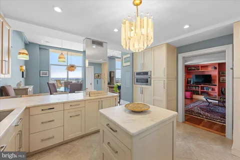 a bedroom with a bed couch and a window