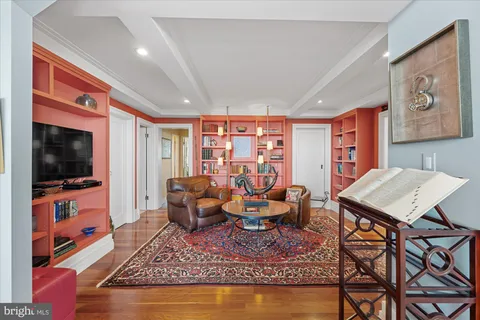 a living room with furniture and a rug