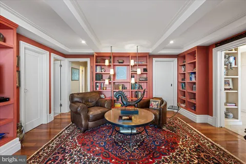 a view of a chairs and table in the balcony