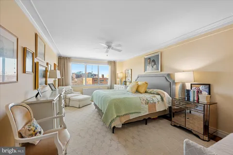 a large space with stainless steel appliances kitchen island granite countertop a refrigerator and a sink