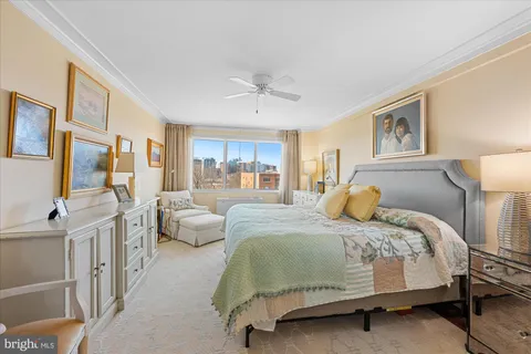 a view of a dining room with furniture wooden floor and chandelier