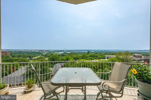 a view of a kitchen with a stove washer and dryer