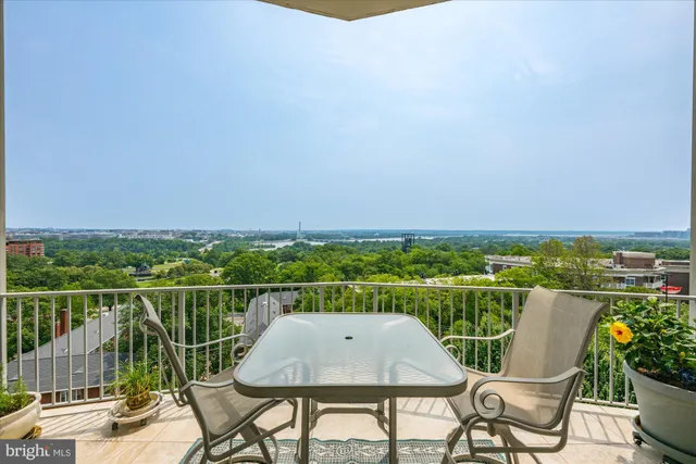a view of a chairs and table in patio