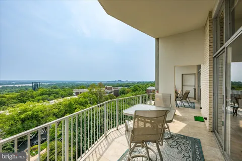 a front view of a building with a garden