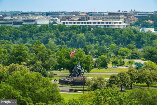 a view of a dining room with furniture wooden floor and chandelier