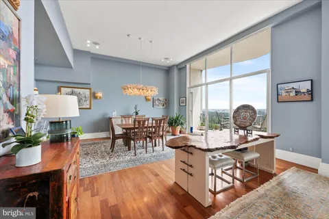 a view of a dining room with furniture window and wooden floor