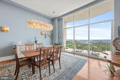 a large kitchen with a table and chairs