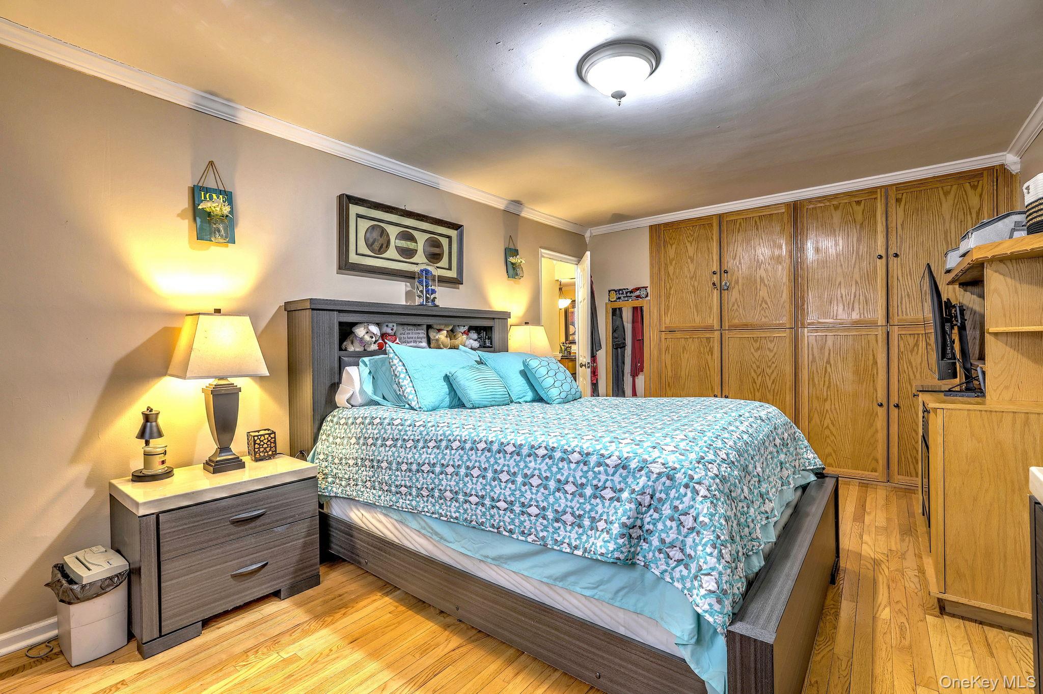 450 Pelham Road, Unit 3B New Rochelle, NY 10805 - Photo 12 of 19 a bed room with a bed and a lamp