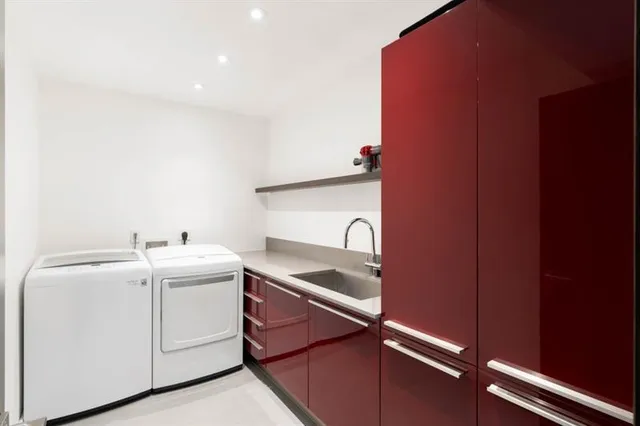 a view of a house with backyard fountain and sitting area