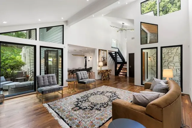 a living room with furniture and a rug