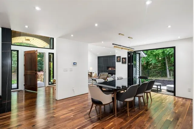 a view of a dining room with furniture window and wooden floor