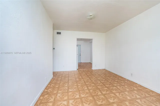 a view of a room with a hallway