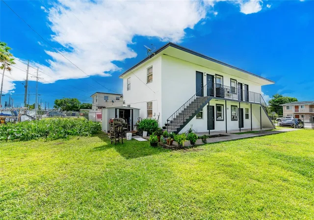 a view of a house with a yard porch and sitting area
