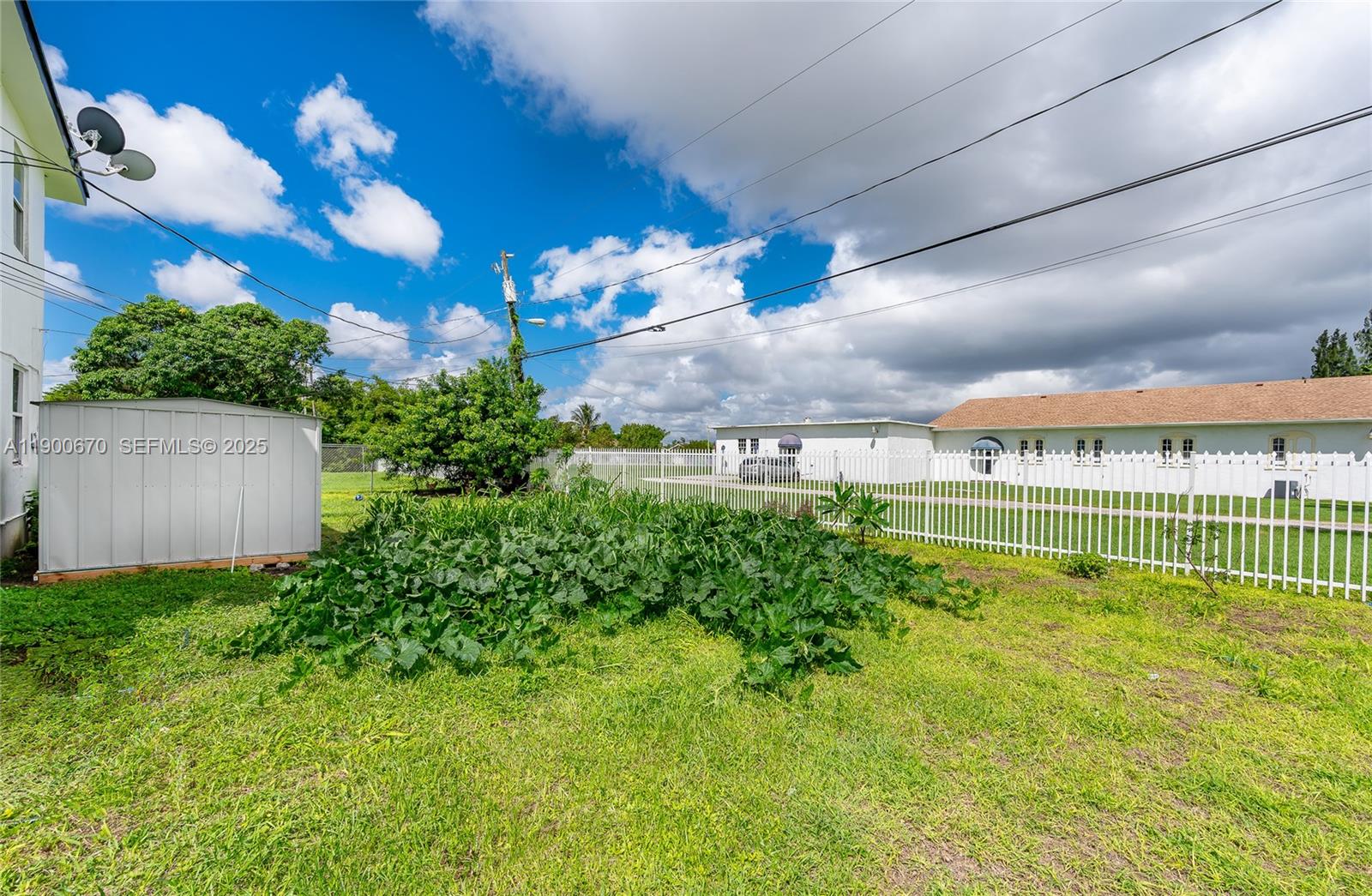 10015 Southwest 170th Terrace, Unit 2 Miami, FL 33157 - Photo 6 of 26 a view of a swimming pool with a yard