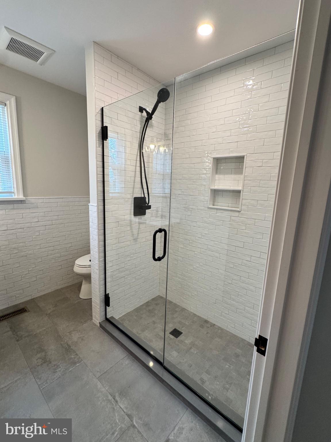 36 Gravel Hill Road Huntingdon Valley, PA 19006 - Photo 9 of 18 Sleek modern shower with elegant tiles.