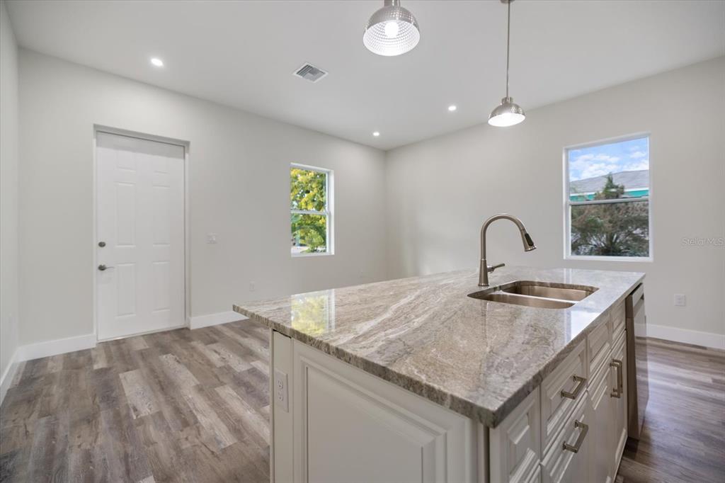 3525 McIntosh Road Sarasota, FL 34232 - Photo 17 of 40 a kitchen with a stove and a sink