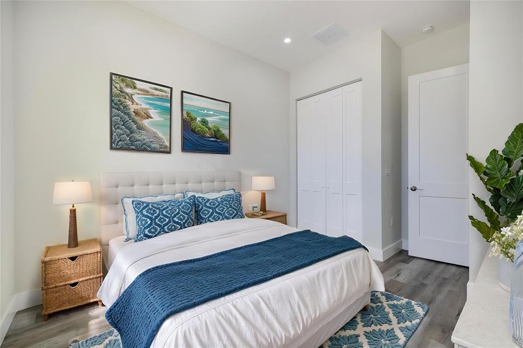 3525 McIntosh Road Sarasota, FL 34232 - Photo 22 of 40 a bedroom with a bed and a painting on the wall